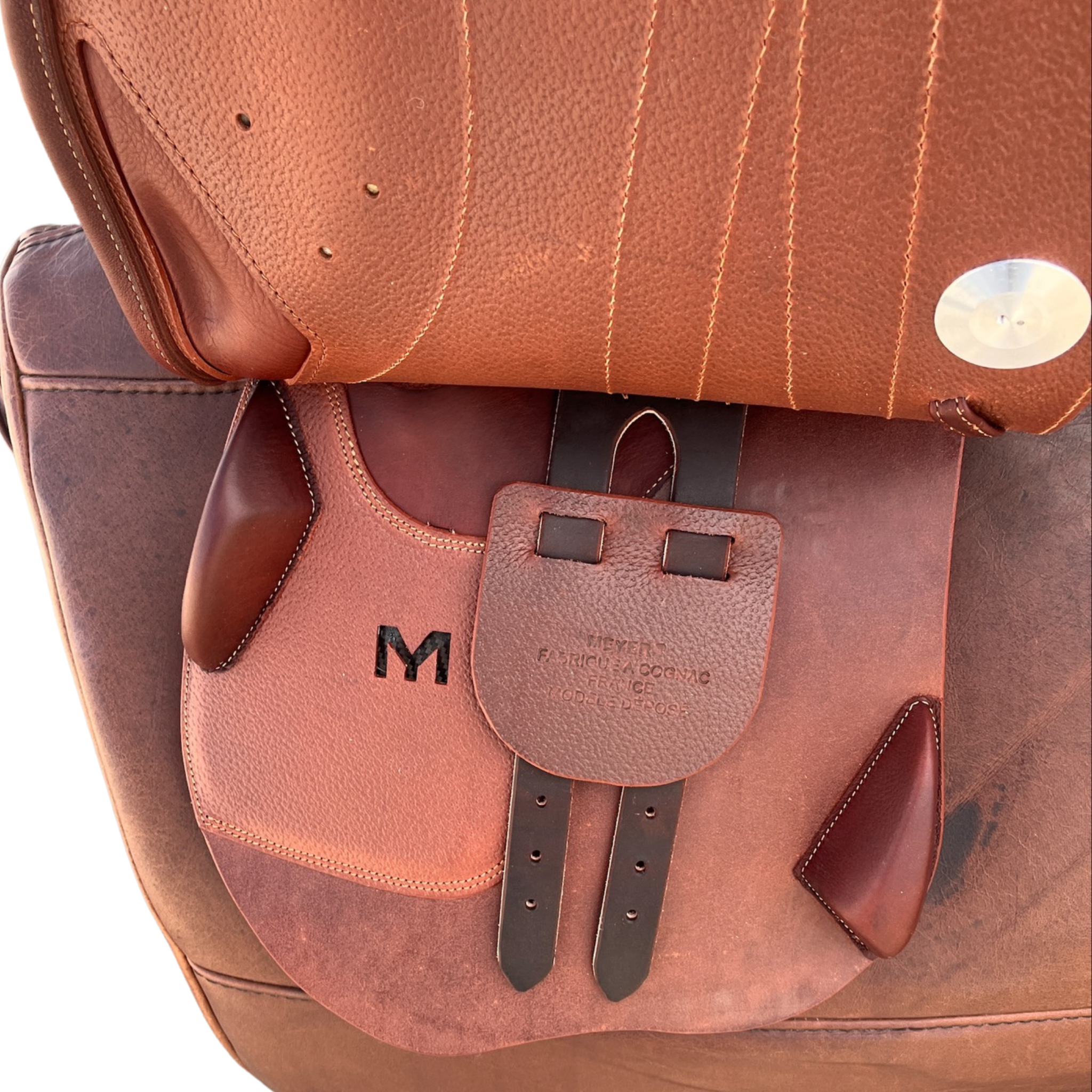 Left side profile view of a Meyer Act 2 jump saddle with the main flap lifted to see the billets, front blocks, and back blocks.