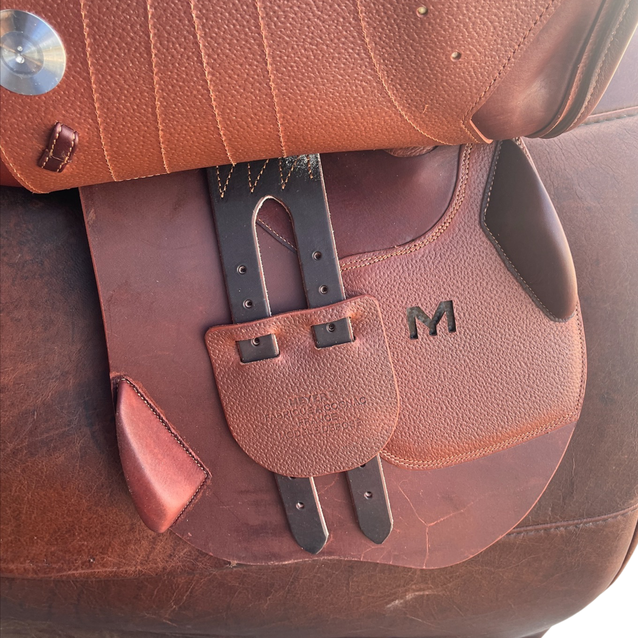Right side profile view of a Meyer Act 2 jump saddle with the main flap lifted to see the billets, front blocks, and back blocks.