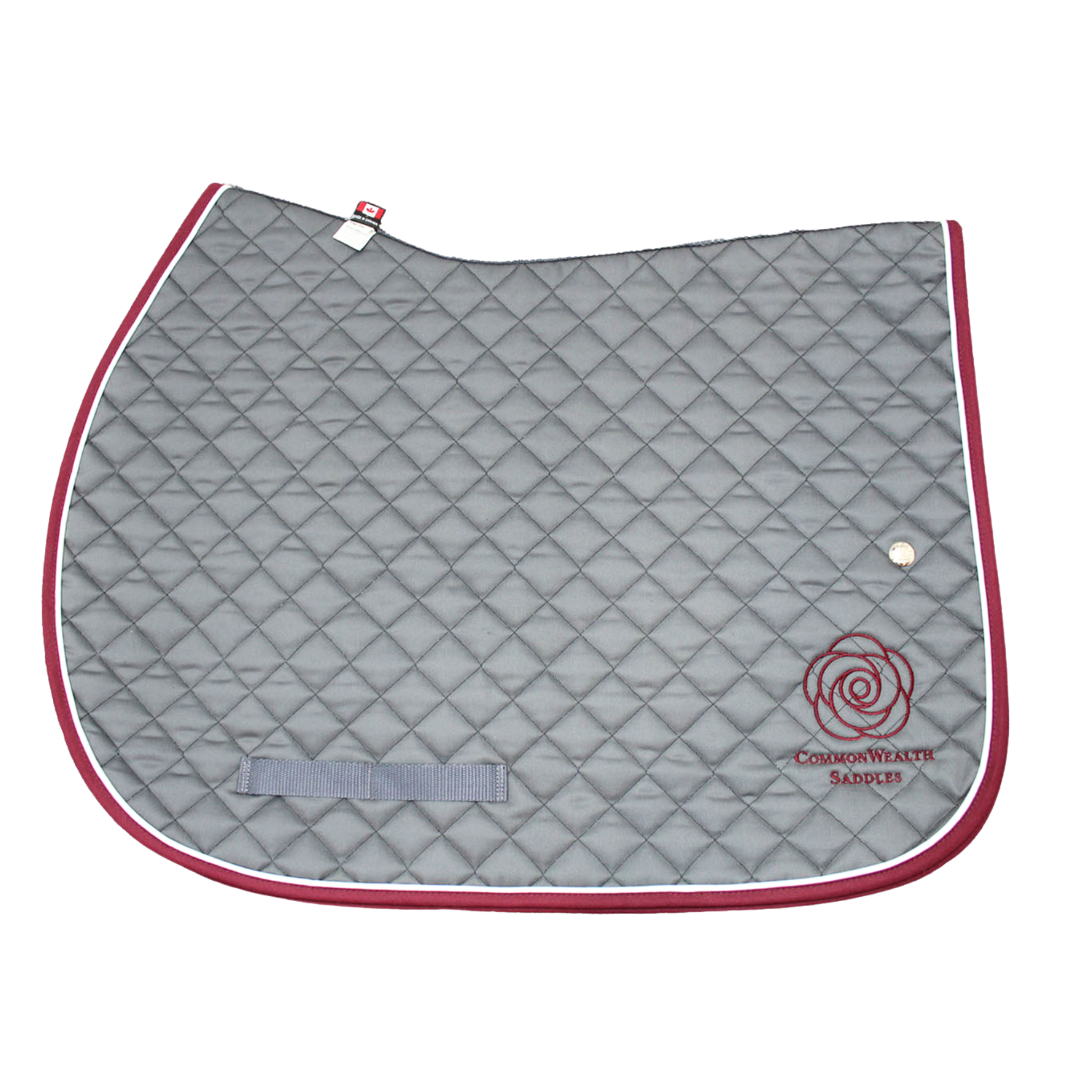A quilted grey Ogilvy saddle pad with burgundy binding and white piping, and the CommonWealth logo on the back left corner of the pad.