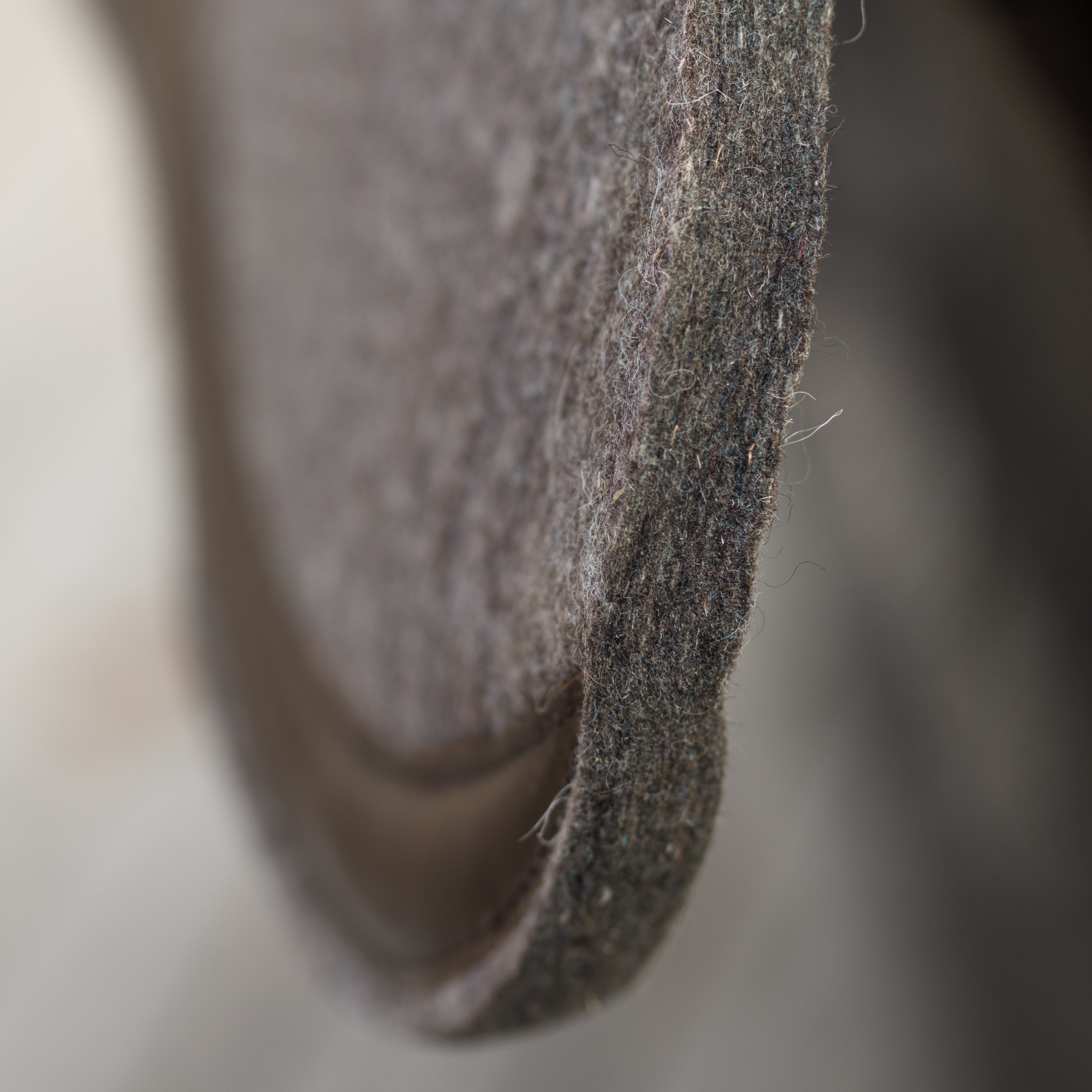 Close-up of the cross section of an 18mm half pad in natural colour to show the thickness of the half pad.