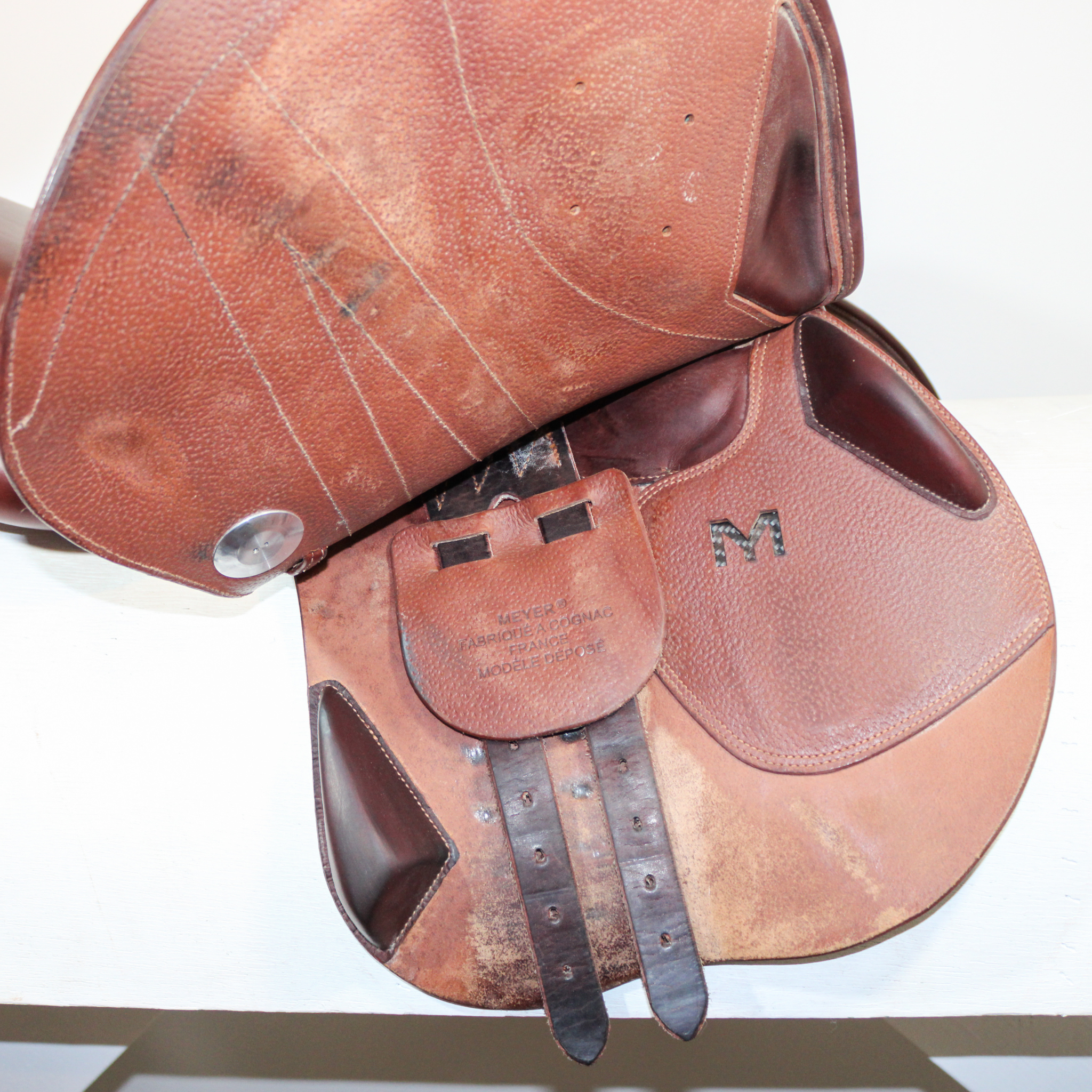 Right side profile view of a Meyer Act 2 jump saddle with the main flap lifted to see the billets, front blocks, and back blocks.
