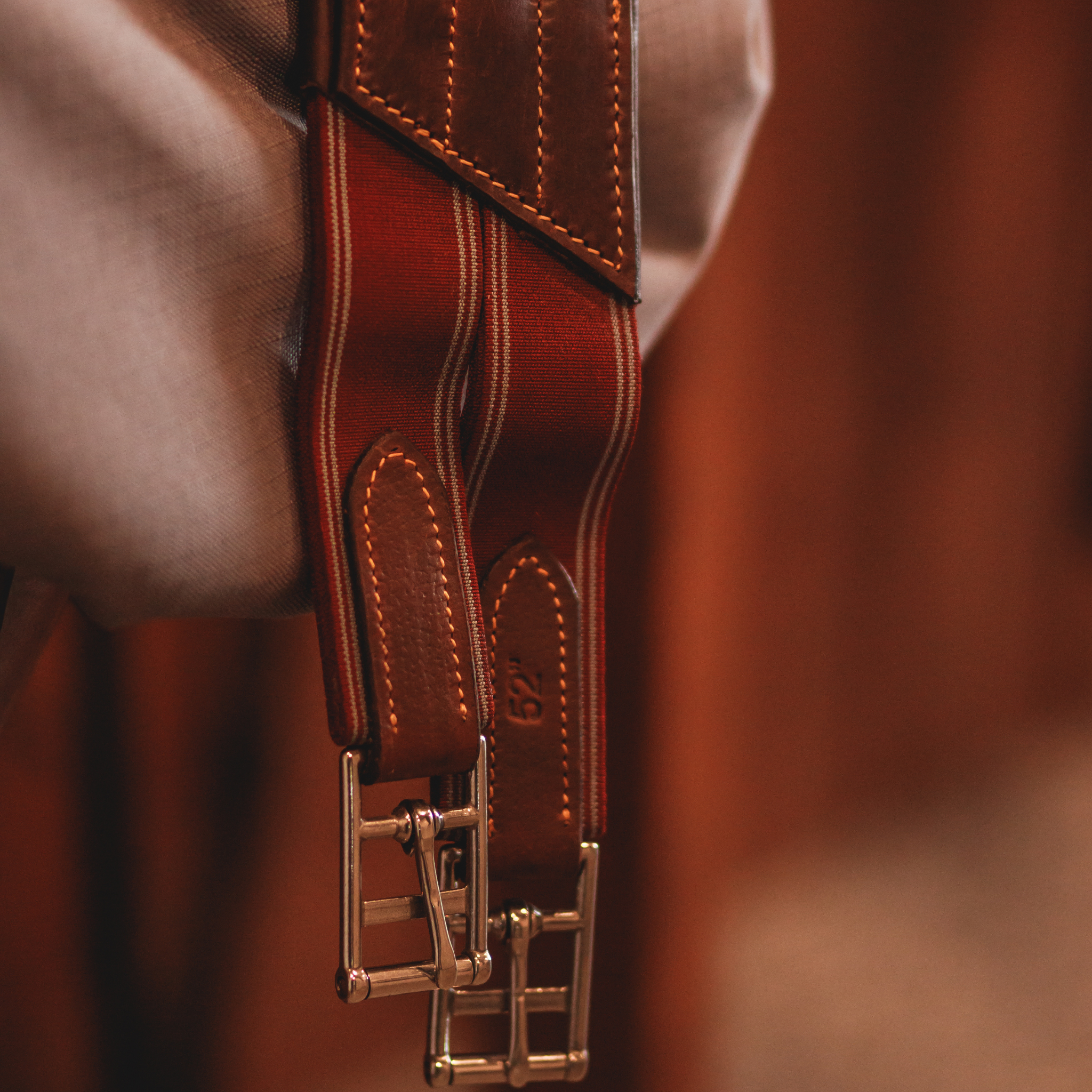 Close up of burgundy girth elastics