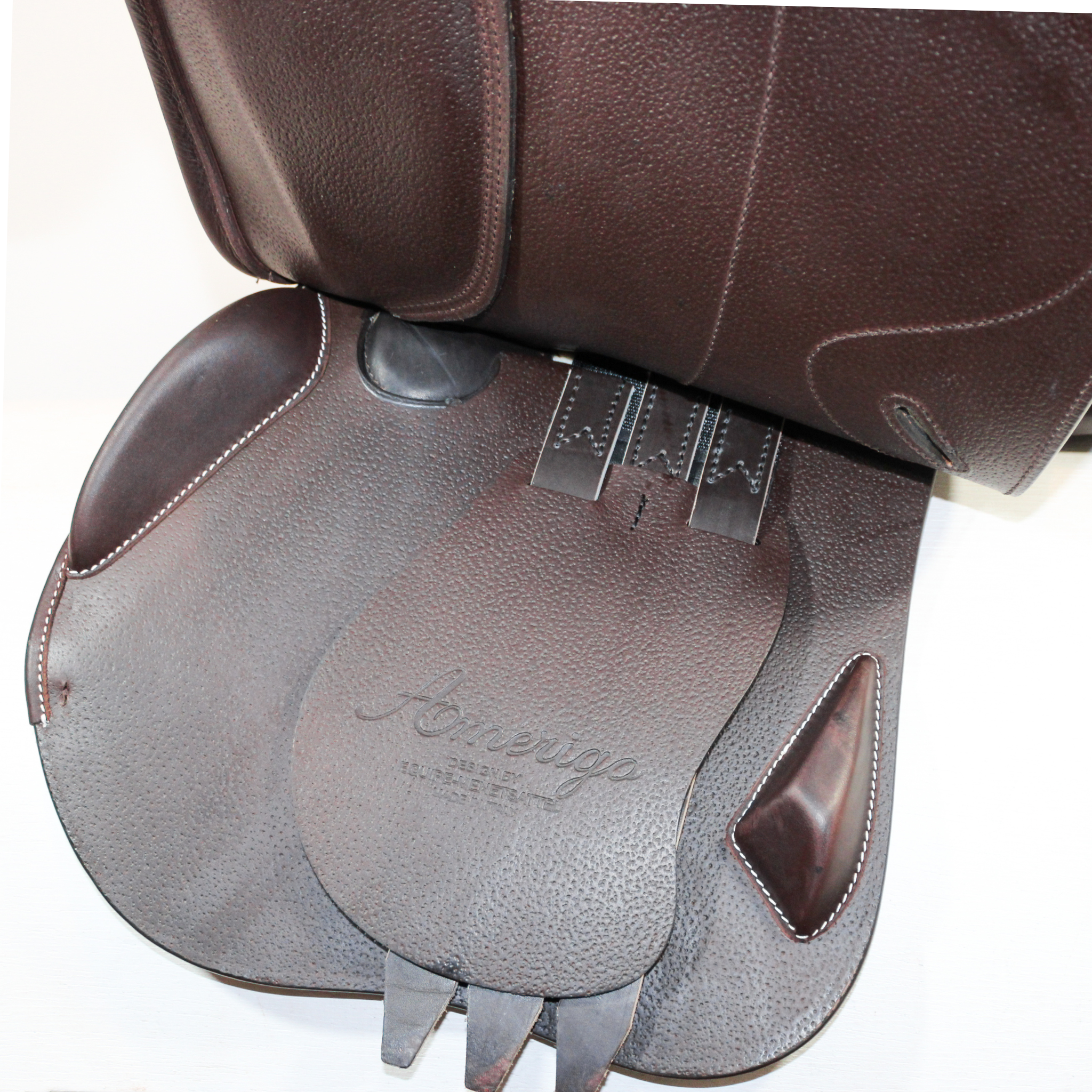 Amerigo Octave jump saddle in brown Pinerolo calf leather; left-side, under flap view of billet area