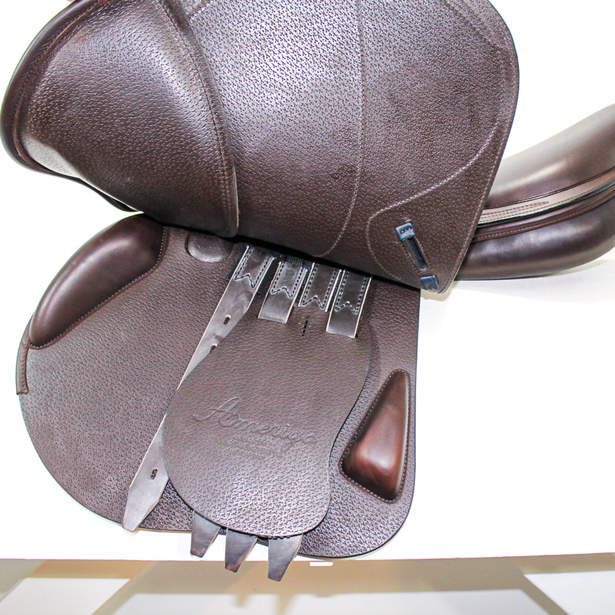 Left side profile view with the main flap lifted to see the billets, front blocks, and back blocks. The underside of the main flap and the sweat flap have a grain texture.