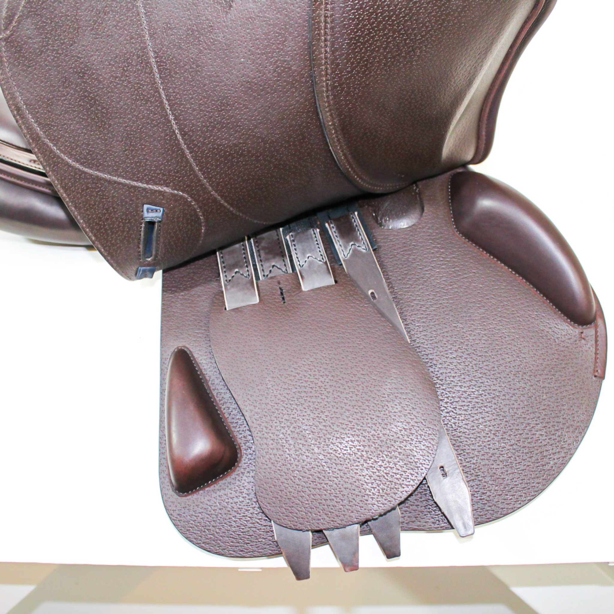 Right side profile view with the main flap lifted to see the billets, front blocks, and back blocks. The underside of the main flap and the sweat flap have a grain texture.