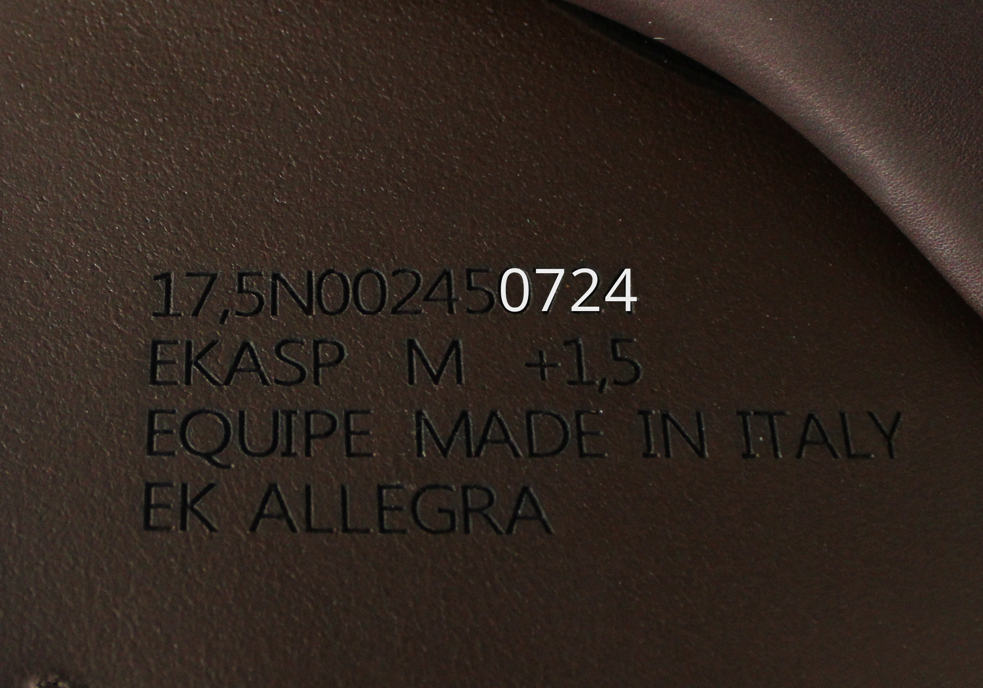 Close up of Equipe Stamp with "0724" highlighted in white text.