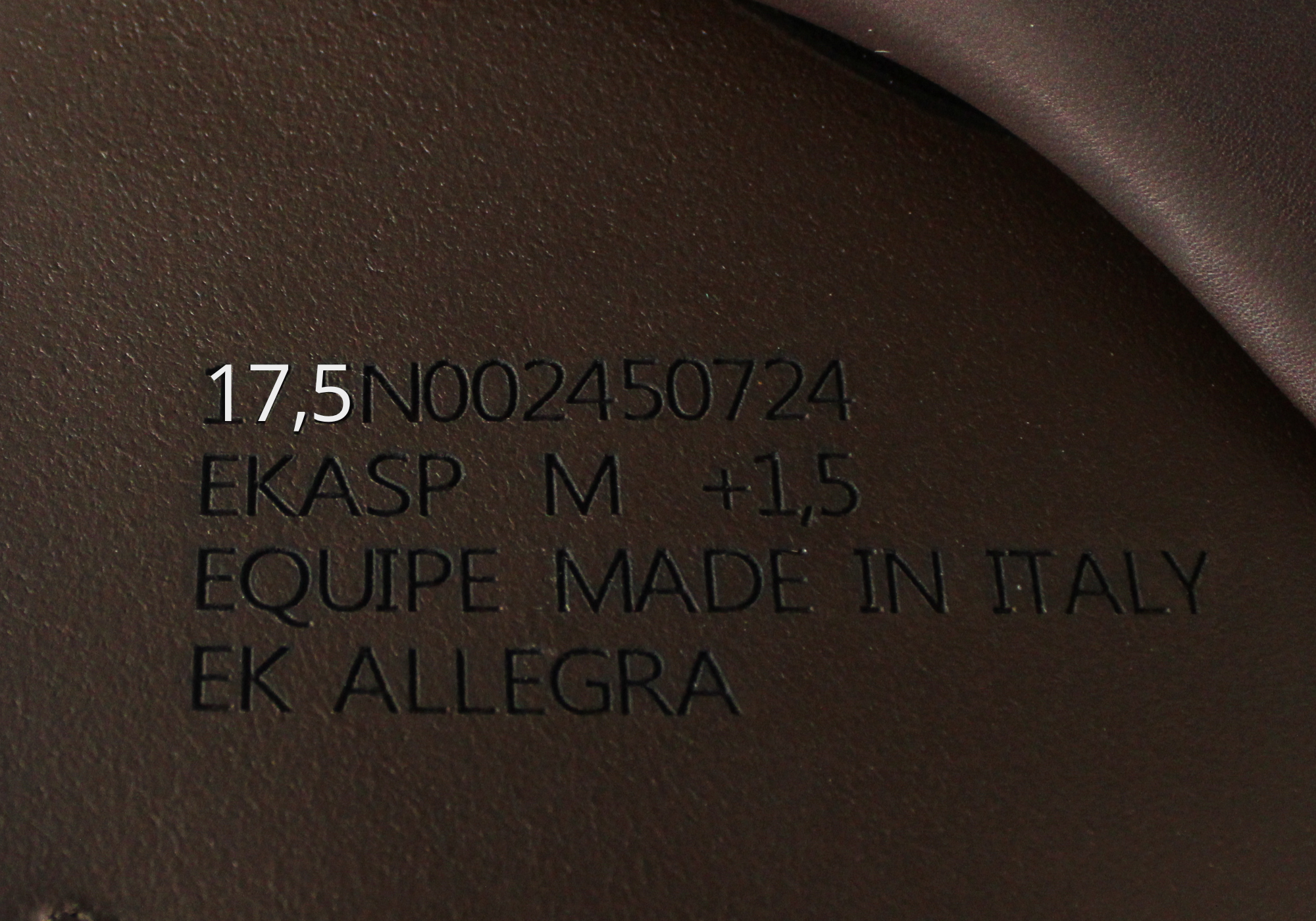 Close up of Equipe saddle stamp with "17,5" highlighted in white text.