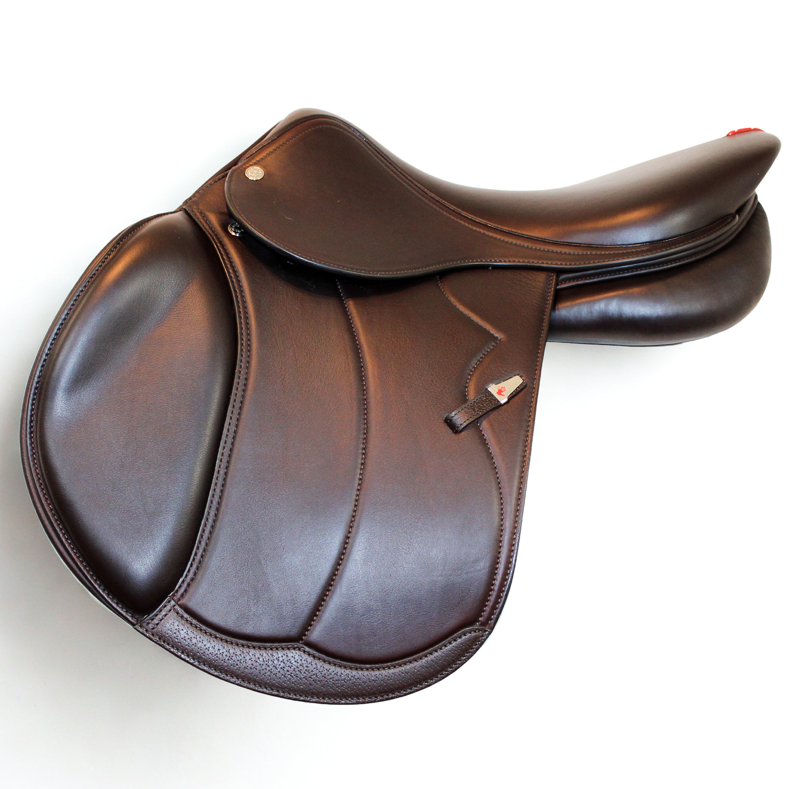 Left side profile view of an Equipe Grand Prix dual flap jump saddle in brown calf leather