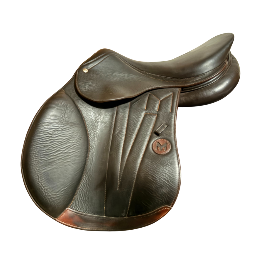 Left side profile view of a Meyer Act 2 jump saddle in brown buffalo leather, with a leather Meyer logo and decorative stitching on the flap.