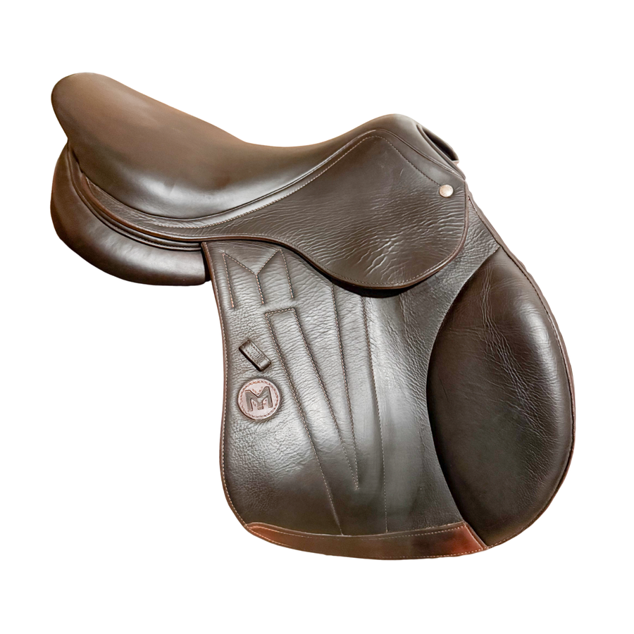 Right side profile view of a Meyer Act 2 jump saddle in brown buffalo leather, with a leather Meyer logo and decorative stitching on the flap.