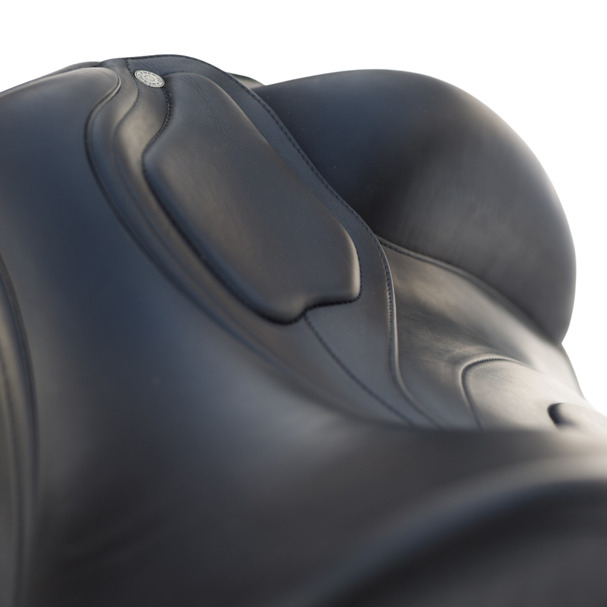 Close up photo showing the external block and padded skirt of a black Amerigo Classic dressage saddle