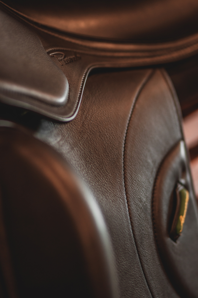 Close up of Amerigo dressage saddle with black Pinerolo leather