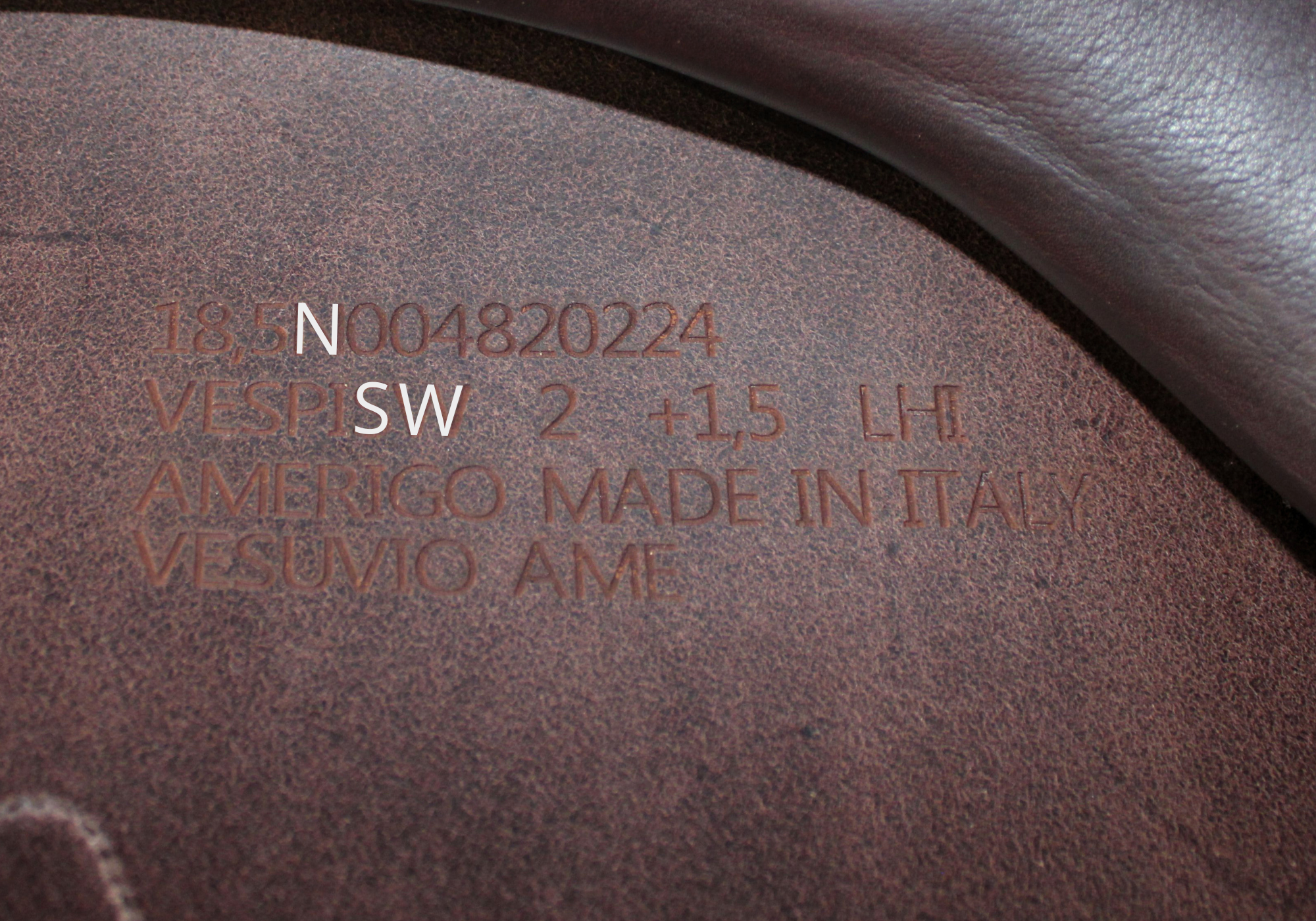 Close up of an Amerigo stamp with "N" & "SW" highlighted in white text.