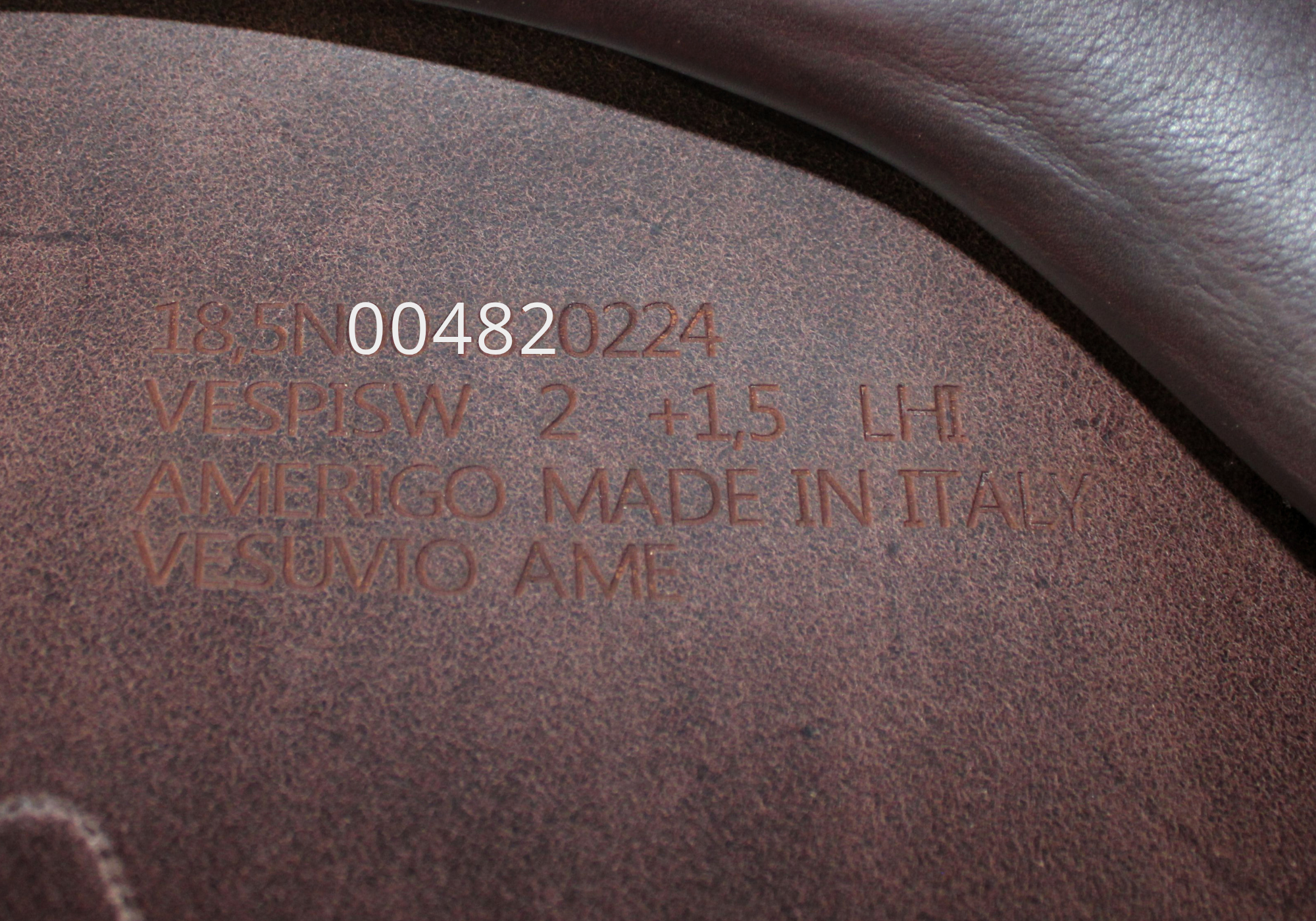 Close up of an Amerigo stamp with "00482" highlighted in white text.