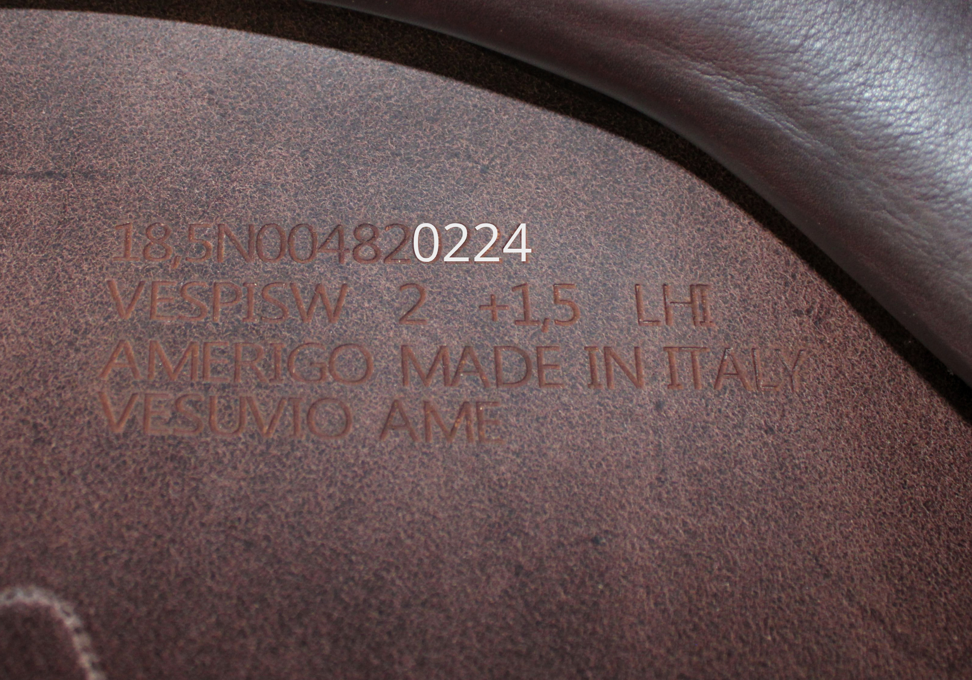 Close up of an Amerigo stamp with "0224" highlighted in white text.
