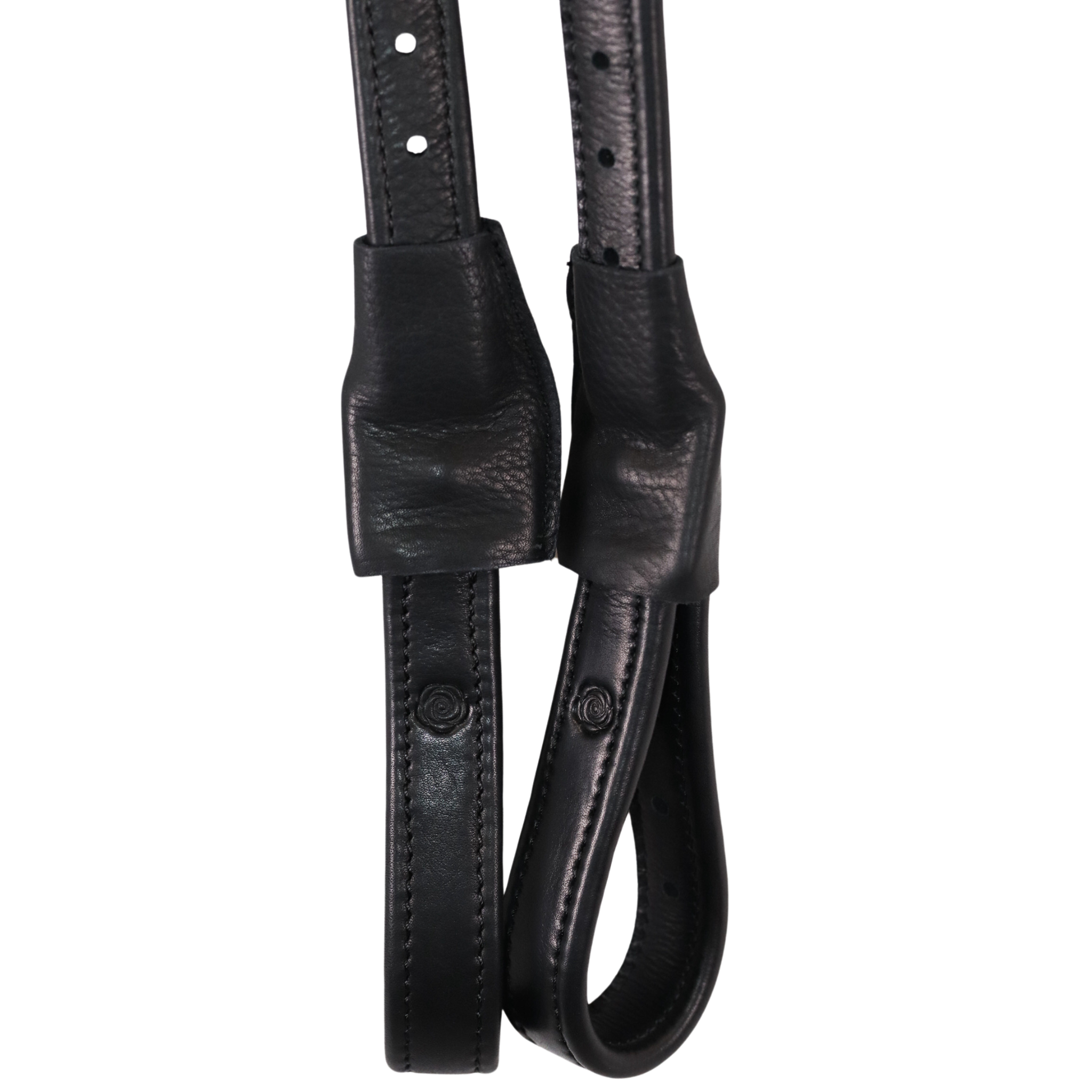 Close up of black Brome Mono Leathers against a white background.