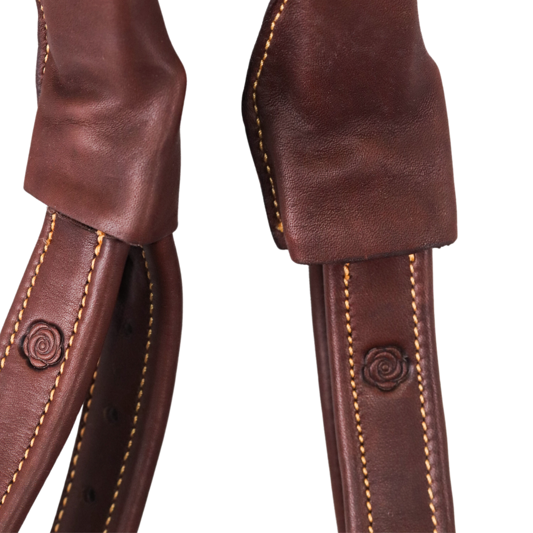 Close up of brown Brome Mono Leathers against a white background.