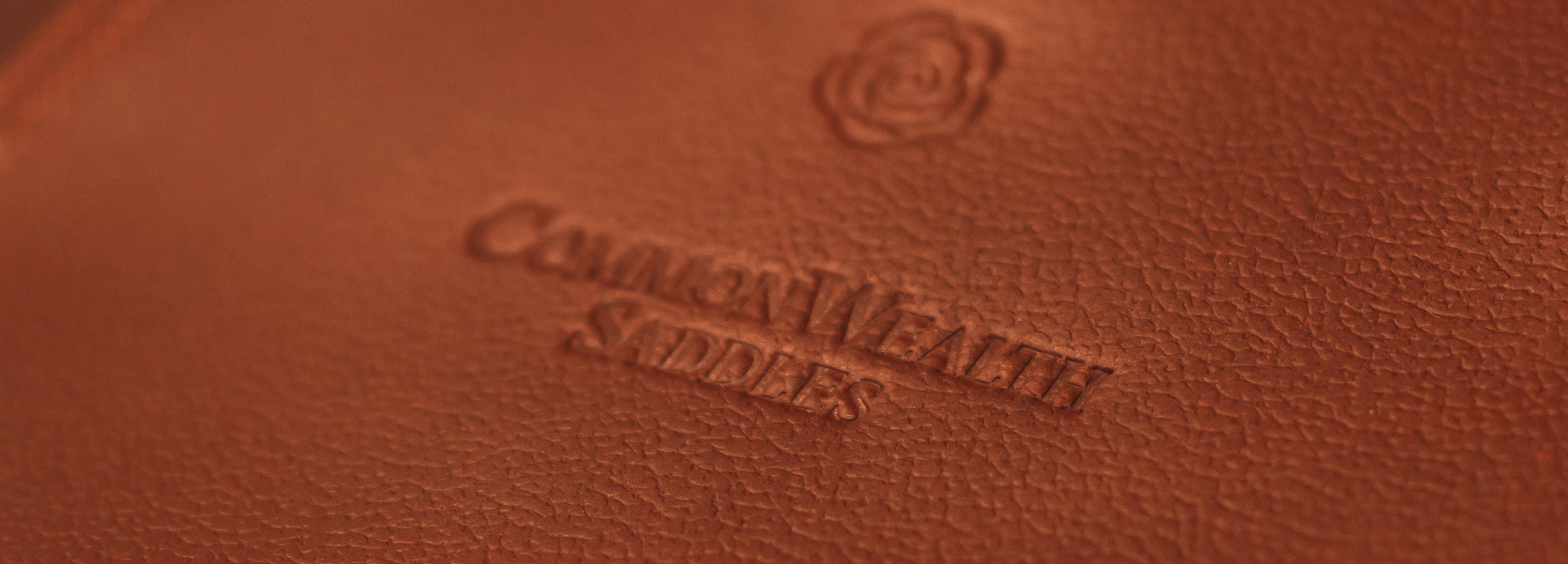Close up of CommonWealth brown leather girth showing leather texture 