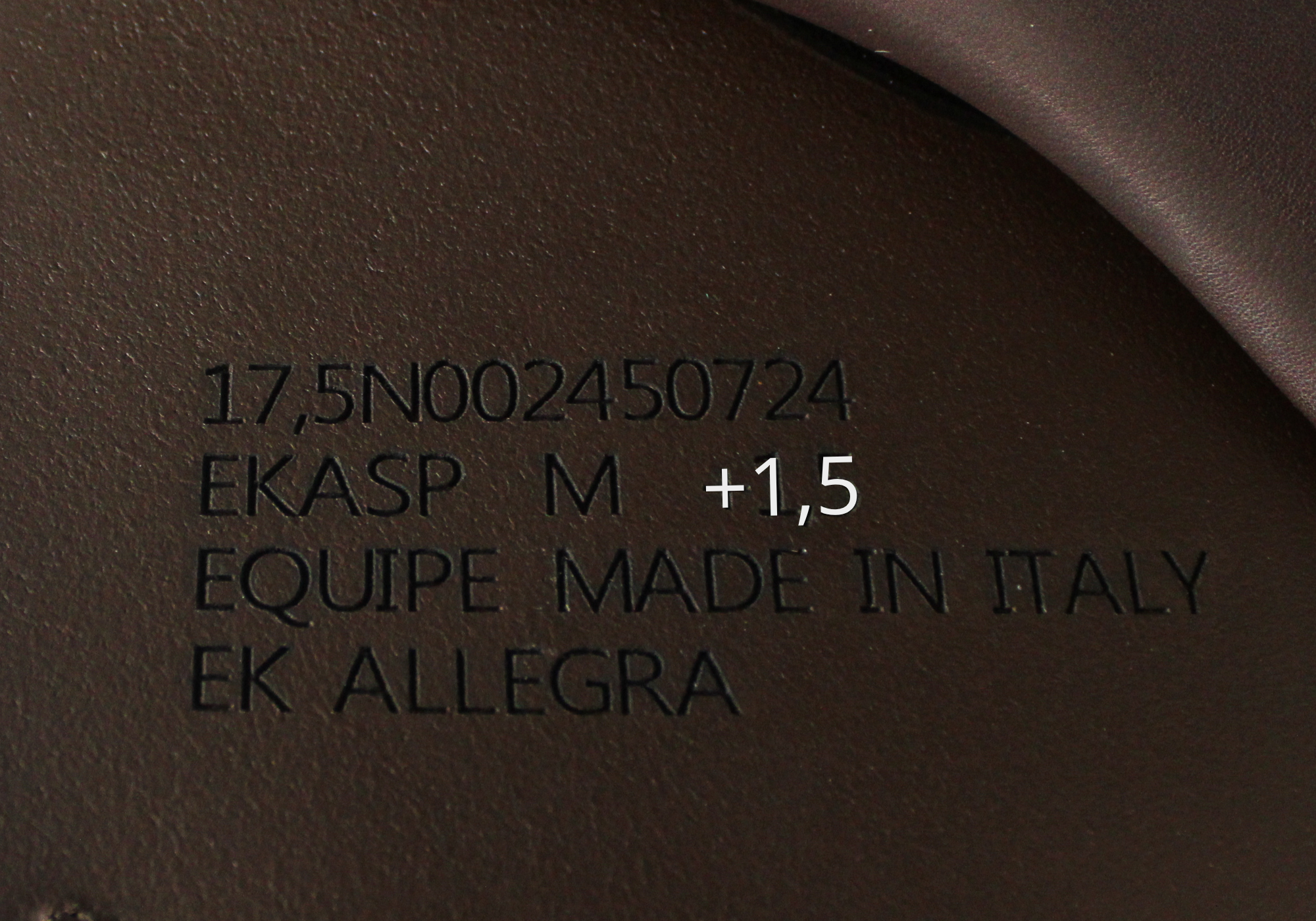 Close up of Equipe Stamp with "+1,5" highlighted in white text. 