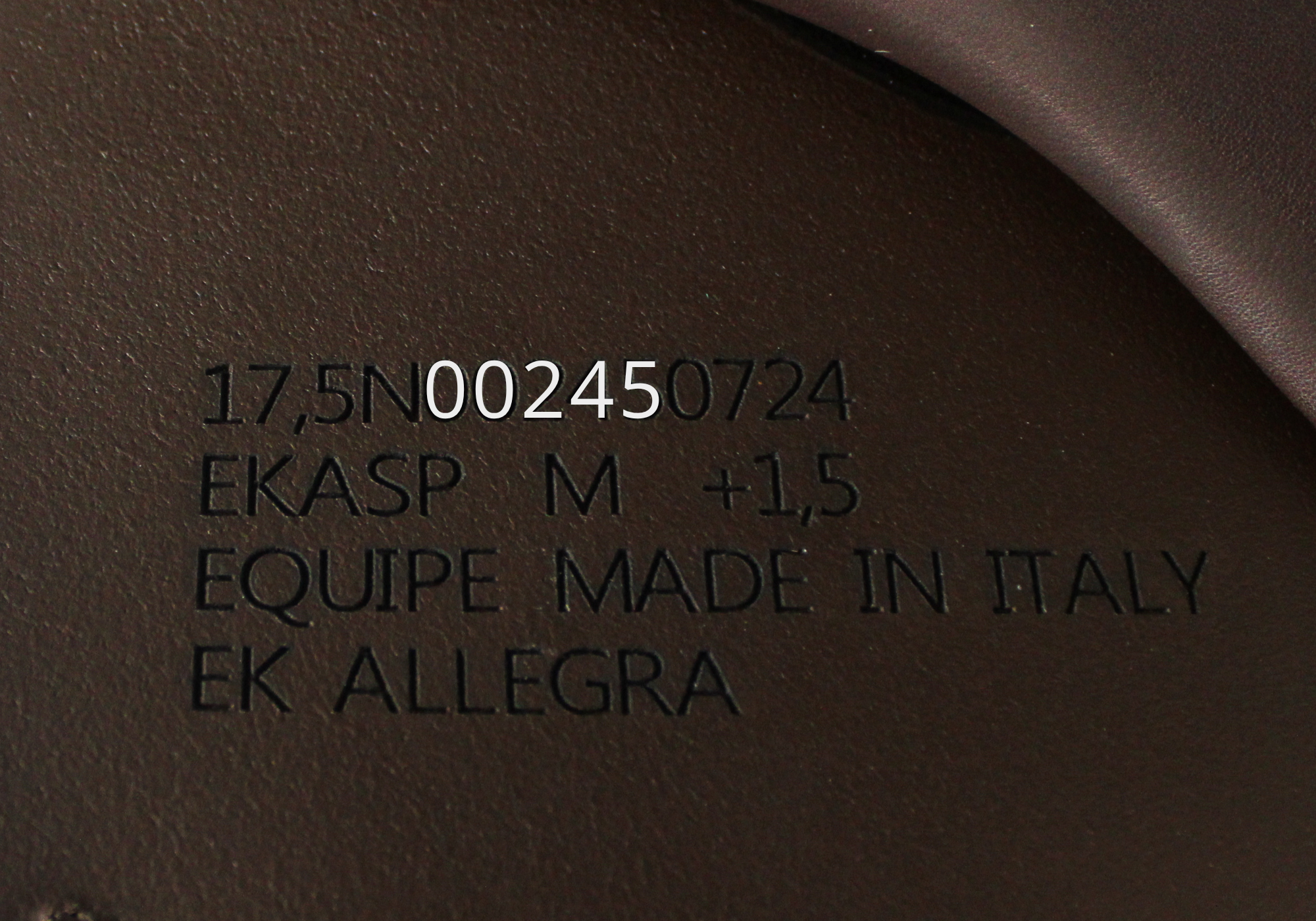 Close up of Equipe Stamp with "00245" highlighted in white text. 