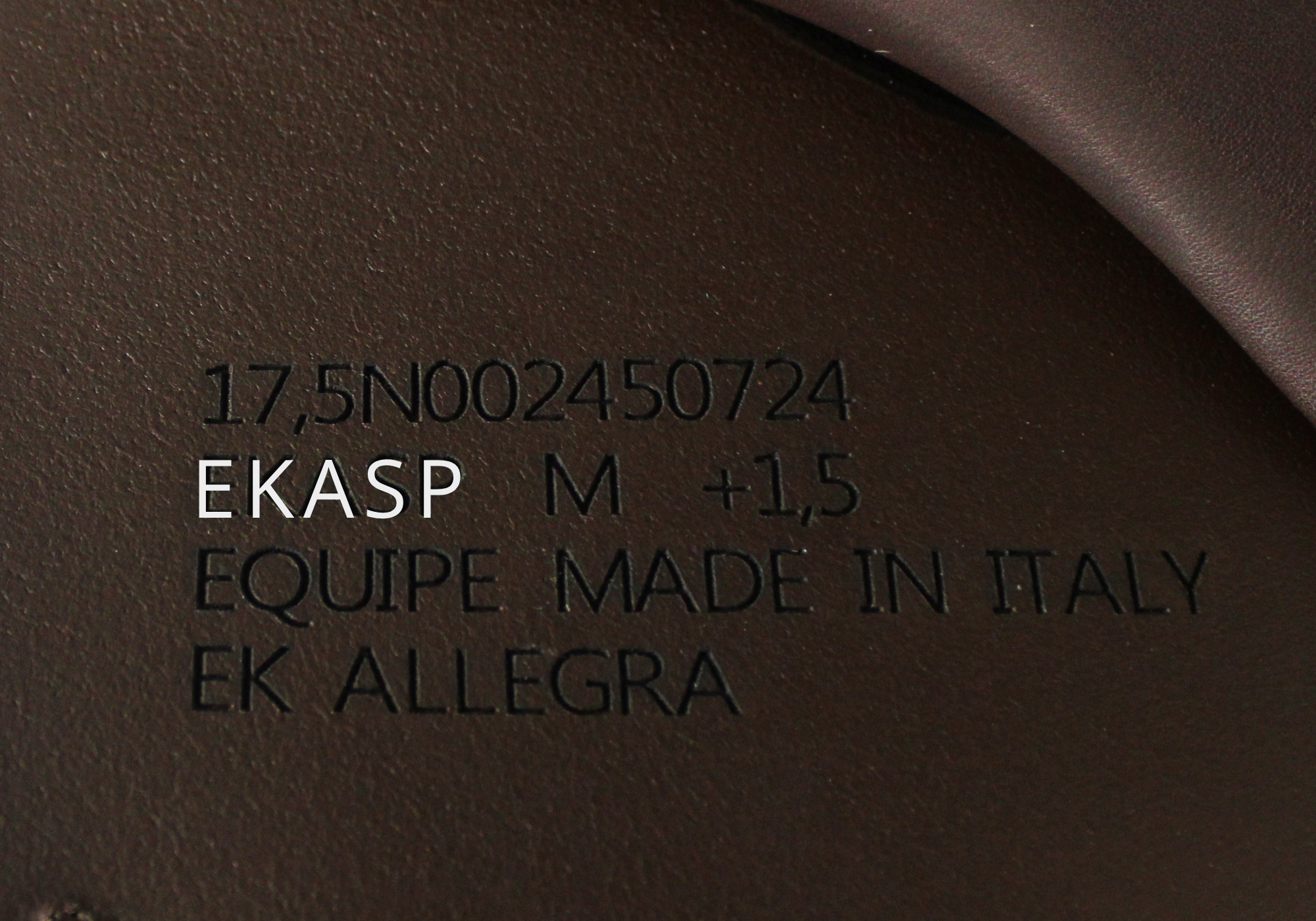 Close up of Equipe Stamp with "EKASP" highlighted in white text. 