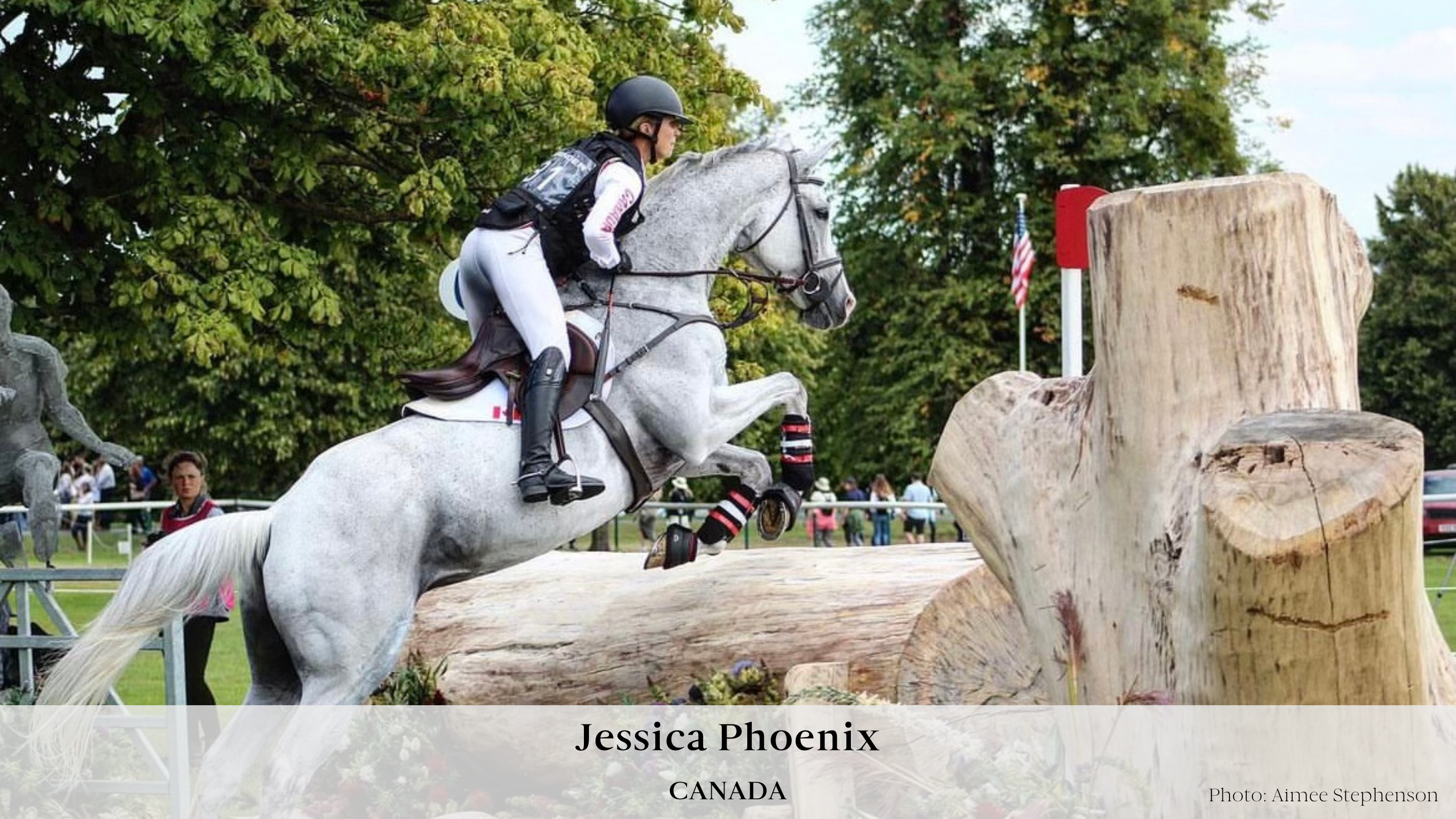Team Canada rider Jessica Phoenix and her grey gelding Wabbit jumping over a large, solid log obstacle on a cross country course