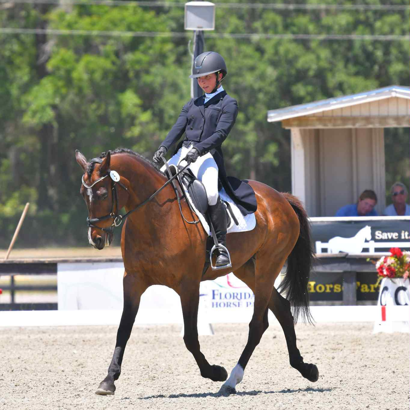 Megan Sauve riding her horse in a dressage competition.