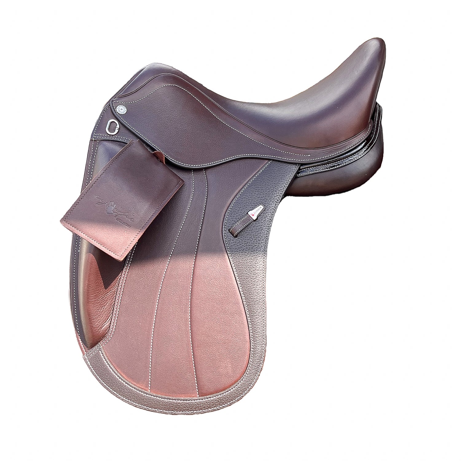 Left side profile view of an Equipe Glamour dressage saddle in brown calf leather, with a silver emblem on the stirrup leather keeper, decorative flap stitching, and external front blocks. 