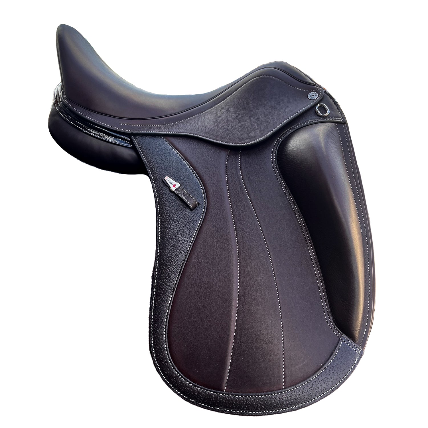 Right side profile view of an Equipe Glamour dressage saddle in brown calf leather, with a silver emblem on the stirrup leather keeper, decorative flap stitching, and external front blocks. 